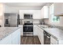 Well-equipped kitchen featuring granite countertops, stainless steel appliances, and an undermount sink at 12013 Beaux Art Ln, Charlotte, NC 28214