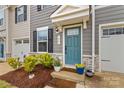 Charming entryway with a bright front door, manicured landscaping, and stone accents at 124 Kristin View Ln # C, Troutman, NC 28166