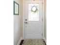 Bright entryway with a stylish white front door and decorative glass panel at 1839 Shumard Ln, Charlotte, NC 28205