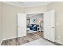 Cozy living room entrance with open double doors and wood floors and a blue sofa at 2840 Hopeton Ct, Monroe, NC 28110