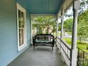 Relaxing front porch with a comfortable bench and neighborhood views at 308 W Monroe St, Salisbury, NC 28144