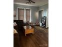 Inviting living room featuring hardwood floors and natural light from the large windows at 325 N Caldwell Ave, Newton, NC 28658