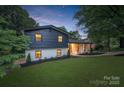 Charming two-story home with a beautifully landscaped yard and inviting exterior at 3326 Winterfield Pl, Charlotte, NC 28205