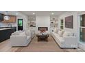 Spacious living room with modern fireplace, neutral decor, and lots of natural light at 3326 Winterfield Pl, Charlotte, NC 28205