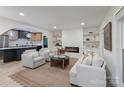 Bright living room with fireplace, modern furnishings, and an open concept layout at 3326 Winterfield Pl, Charlotte, NC 28205