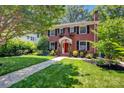 Attractive two-story brick home featuring lush landscaping and a well-manicured lawn at 361 5Th Nw St, Hickory, NC 28601