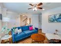 Bright living room boasts hardwood floors, ceiling fan and a cozy seating area at 4060 Zilker Park Dr, Charlotte, NC 28217