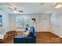 Inviting living room featuring hardwood floors, bright windows, and stylish furnishings at 4060 Zilker Park Dr, Charlotte, NC 28217