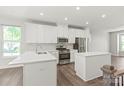 Bright, updated kitchen featuring white cabinets, stainless steel appliances, and a center island at 420 E 16Th St, Charlotte, NC 28206