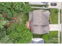 Aerial view of a home with a deck and patio furniture, mature trees, and manicured lawn at 4407 Beauvista Dr, Charlotte, NC 28269