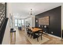 Dining area with modern chandelier and open to the gourmet kitchen at 4520 Radler Ct, Charlotte, NC 28217