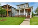 Charming two-story home with inviting front porch and landscaped yard at 517 E Main St, Rock Hill, SC 29730