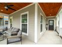 Relaxing front porch with comfortable seating and stylish ceiling at 517 E Main St, Rock Hill, SC 29730