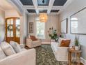 Comfortable living room with coffered ceiling, neutral tones, and a large window for natural light at 705 Woburn Abbey Dr, Fort Mill, SC 29715