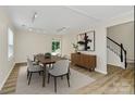 Bright dining room features hardwood floors, stylish furniture, and a modern aesthetic at 720 Reigate Rd, Charlotte, NC 28262