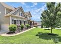 Charming home with well-manicured lawn, inviting curb appeal and attached garage at 9011 Kensington Forest Dr, Harrisburg, NC 28075