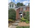 Charming brick home with a welcoming front entrance and well-manicured garden in a lovely neighborhood at 9121 Kings Canyon Dr, Charlotte, NC 28210