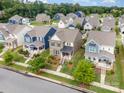 A high angle view shows a neighborhood of two story homes with sidewalks and manicured lawns at 915 Claires Creek Ln, Davidson, NC 28036