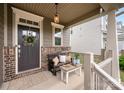 Inviting front porch with comfortable seating and stylish decor at 915 Claires Creek Ln, Davidson, NC 28036