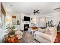 Cozy living room with fireplace, neutral decor, and ample seating at 915 Claires Creek Ln, Davidson, NC 28036