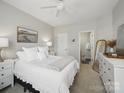 Calm and inviting bedroom featuring a comfortable bed, neutral tones, and ample natural light at 1061 Woodglen Ln, Matthews, NC 28104