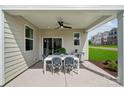Covered patio with modern ceiling fan and stylish dining set, perfect for outdoor entertaining at 1213 Margo Mannor Dr, Fort Mill, SC 29708