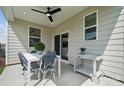 Inviting covered patio features dining set, serving cart, and views of the community at 1213 Margo Mannor Dr, Fort Mill, SC 29708