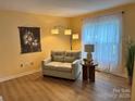 Cozy living room illuminated by natural light and featuring neutral colors at 1228 Hidden Creek Cir, Hickory, NC 28602