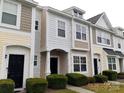 Well-maintained townhouse exteriors with manicured greenery and inviting facades at 13441 Calloway Glen Dr, Charlotte, NC 28273