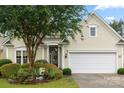 This home boasts charming curb appeal with a neatly landscaped yard and an attached two-car garage at 15152 Legend Oaks Ct, Indian Land, SC 29707