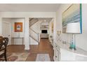 Bright foyer with hardwood floors, showcasing an open floor plan and staircase at 1543 Ab Moore Jr Dr, Indian Trail, NC 28079
