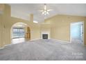 Spacious living room with fireplace and archway to dining area provides lots of light at 1744 Marsley Ln, Rock Hill, SC 29730