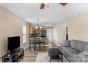 Cozy living room with views of the dining area and kitchen with ample light at 1907 Sandal Brook Rd, Fort Mill, SC 29707