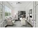 Bright home office with large windows, modern furnishings, and stylish decor at 198 Wrangell Dr, Mooresville, NC 28117