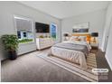 Cozy main bedroom with a TV, large windows, and a neutral color palette at 27415 Cinderella Cir, Lancaster, SC 29720