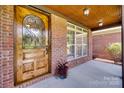 Close up of the front door with decorative glass and brickwork at 5164 Mill Race Ln, Lancaster, SC 29720