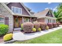 Welcoming front porch and landscaped walkway showcasing this well-maintained home at 5164 Mill Race Ln, Lancaster, SC 29720