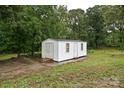 Exterior view of a white shed at 5222 Sikes Mill Rd, Monroe, NC 28110