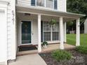 Inviting front porch with decorative plants and charming details at 5741 Bentgrass Run Dr, Charlotte, NC 28269