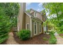 Charming exterior with chimney and arched windows at 8624 Canter Post Dr, Charlotte, NC 28216