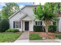 Charming home featuring a well-maintained lawn, a black door, and tasteful shrubbery at 945 Heritage Pkwy, Fort Mill, SC 29715