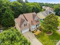 Aerial view of home surrounded by mature trees, showcasing its location within a peaceful residential area at 10703 Back Ridge Rd, Charlotte, NC 28277