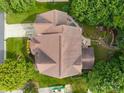 Top-down aerial view of a well-maintained property with a detailed roof and lush landscaping at 10703 Back Ridge Rd, Charlotte, NC 28277