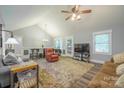 Inviting living area with vaulted ceiling, hardwood floors, and a cozy layout at 121 Jefferson Dr, Locust, NC 28097
