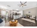 Bright living area features a kitchen, stainless appliances, an island with seating, and an inviting seating area at 12220 Huntersville Concord Rd, Huntersville, NC 28078