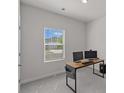 Home office with large window for natural light, neutral walls and carpet at 1344 Sweet Pea St, Monroe, NC 28110
