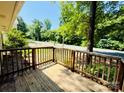 Inviting wooden porch with railing, perfect for enjoying the peaceful neighborhood views at 1583 Green Circle Dr, Gastonia, NC 28054