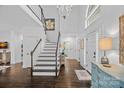 Inviting foyer features high ceilings, elegant chandelier, and dark hardwood flooring at 20312 Deep Cove Ct, Cornelius, NC 28031