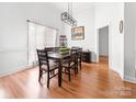 Elegant dining room featuring a modern light fixture, and a large window at 212 Victoria Cir, York, SC 29745