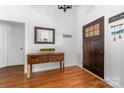 Inviting entryway with wood floors, console table, mirror, and decorative accents at 212 Victoria Cir, York, SC 29745